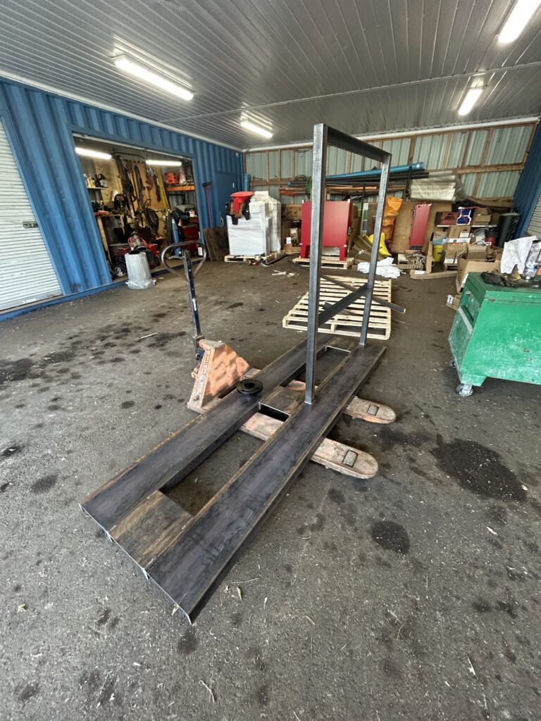 Mobile welder in Ottawa fit-up work on a custom pump assembly, SIMWELDS